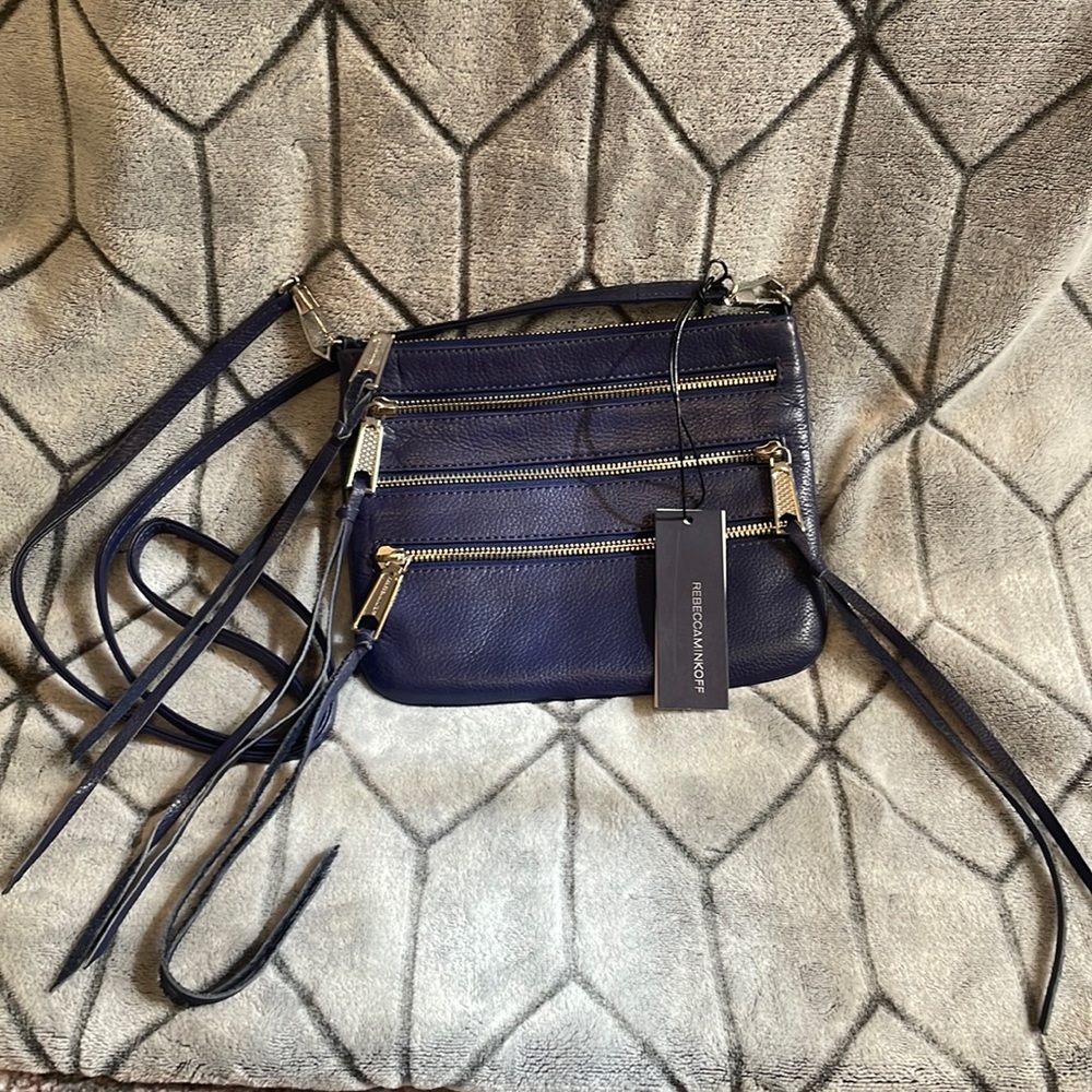 Rebecca Minkoff dark blue 3-zipper crossbody pouch.